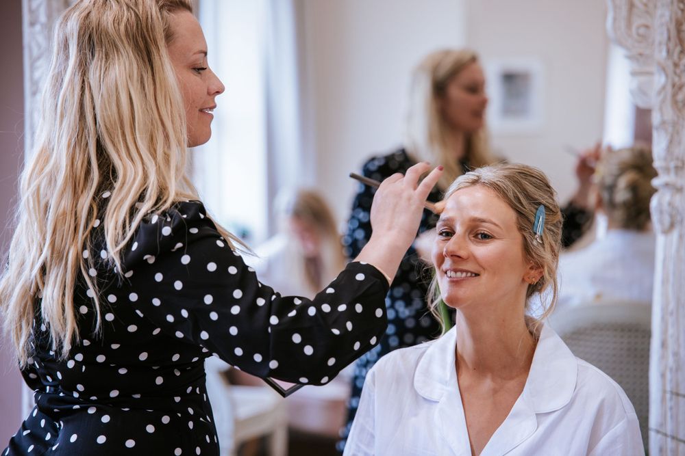 Bride having her make up done in Cain Manor, Hampshire, captured by Sylvia Patchell Photography.