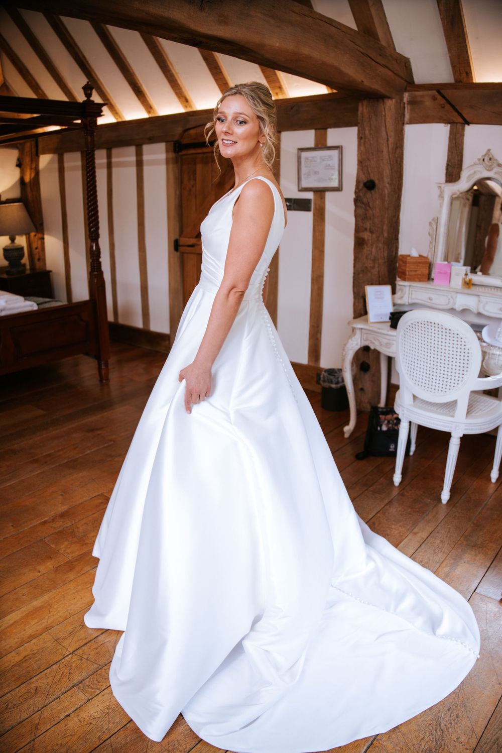 Bride in her wedding dress in Cain Manor, Hampshire, captured by Sylvia Patchell wedding photographer.