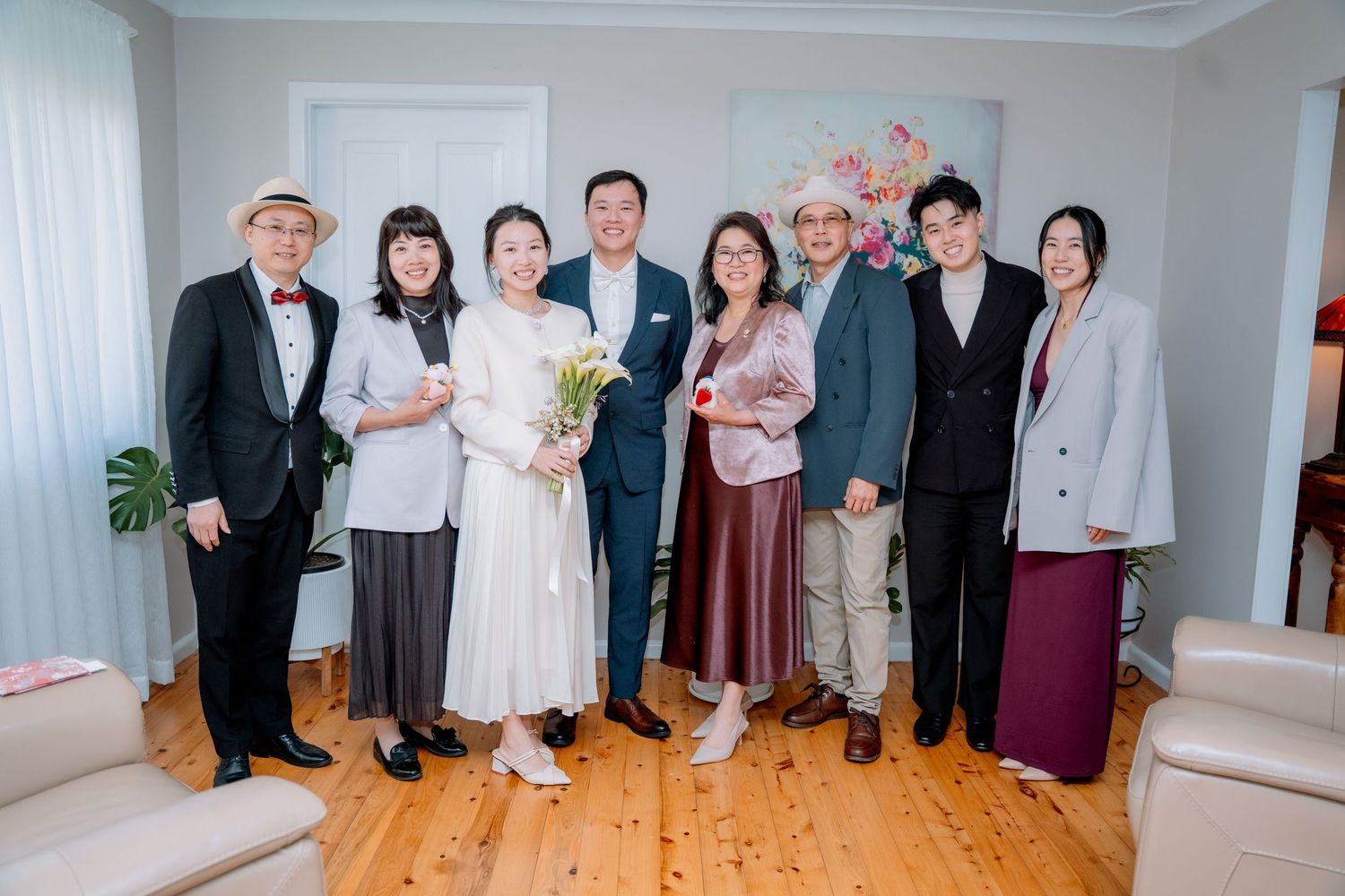 Small group photo of the couple with close family and friends - intimate elopement with a few guests