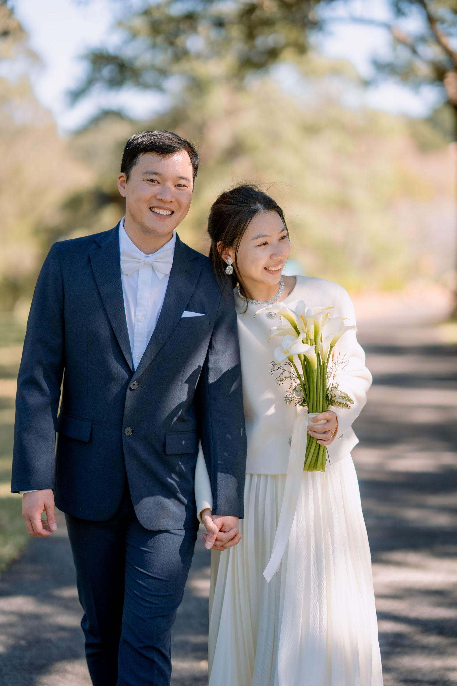 Happy bride leans on her smiling groom during an outdoor elopement photo shoot - Sydney elopement photographer