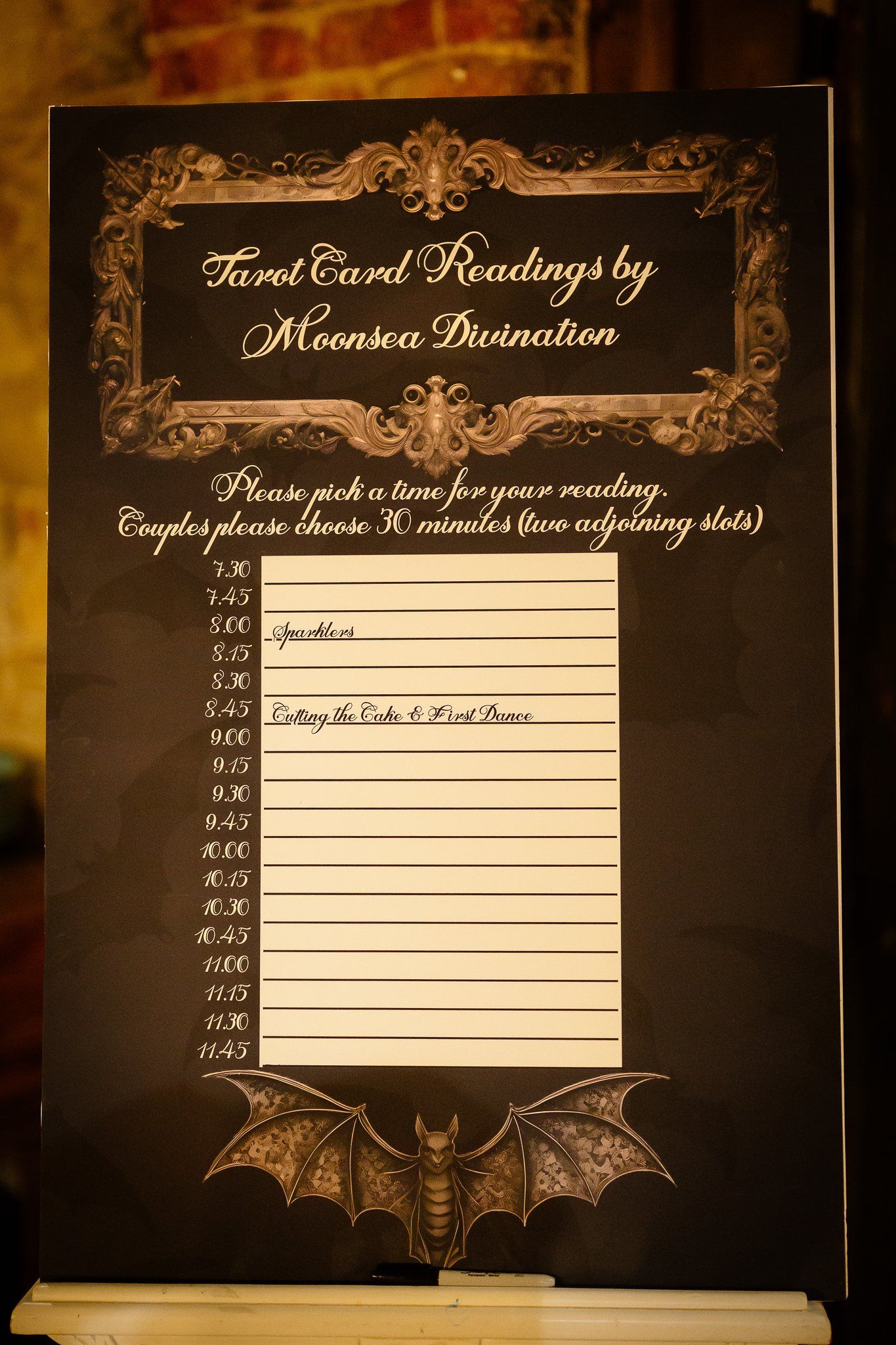 Tarot card reading sign-up board by Moonsea Divination at a Halloween wedding