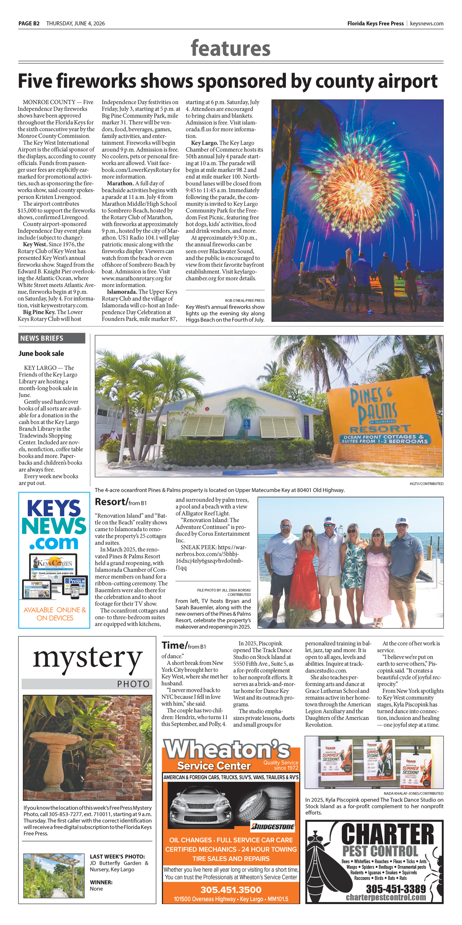 Newspaper features page showing fireworks shows sponsored by county airport with local business ads and articles.
