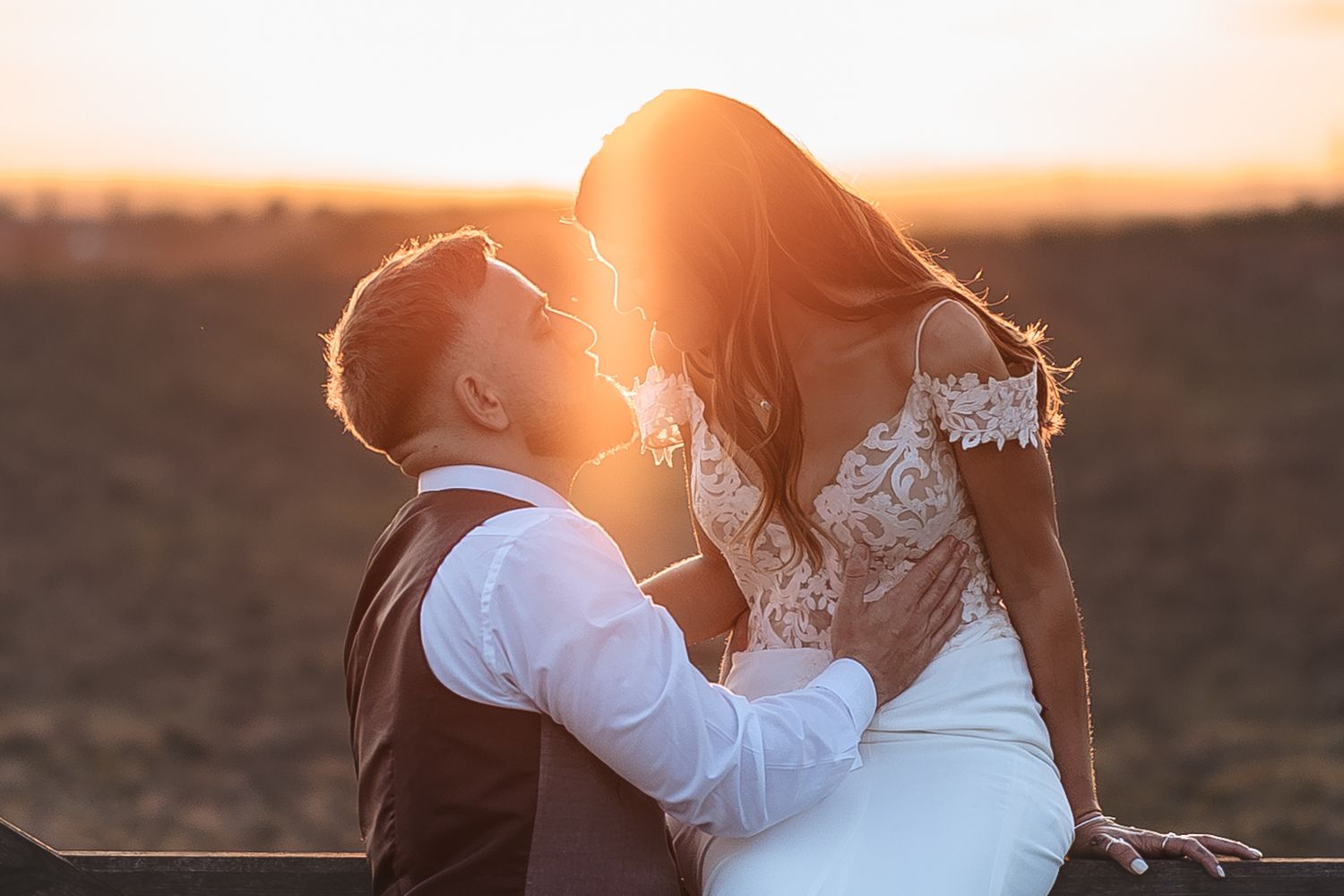 Bride and groom enjoying relaxed couple sunset portraits