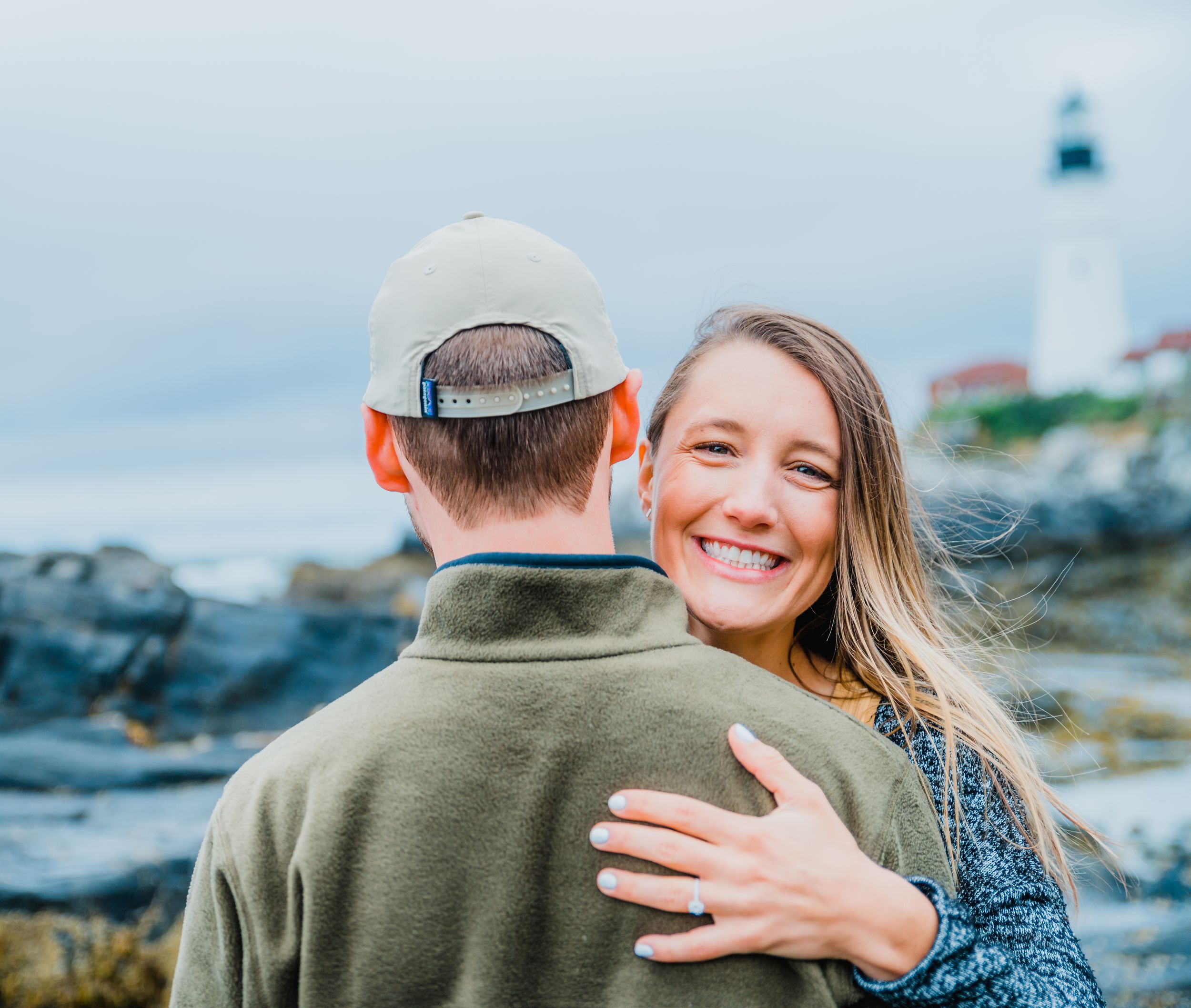 Bride showing off engagement ring at Portland Headlight in Portland, Me