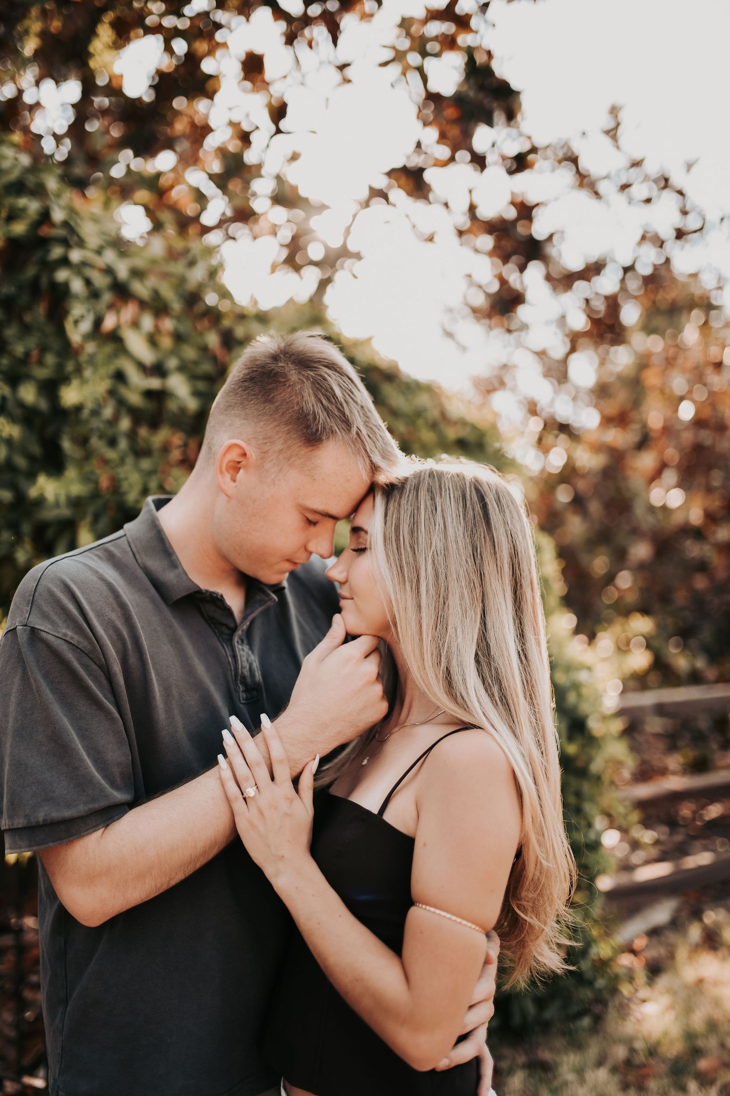 Bride-to-be showing off her new engagement ring after saying yes