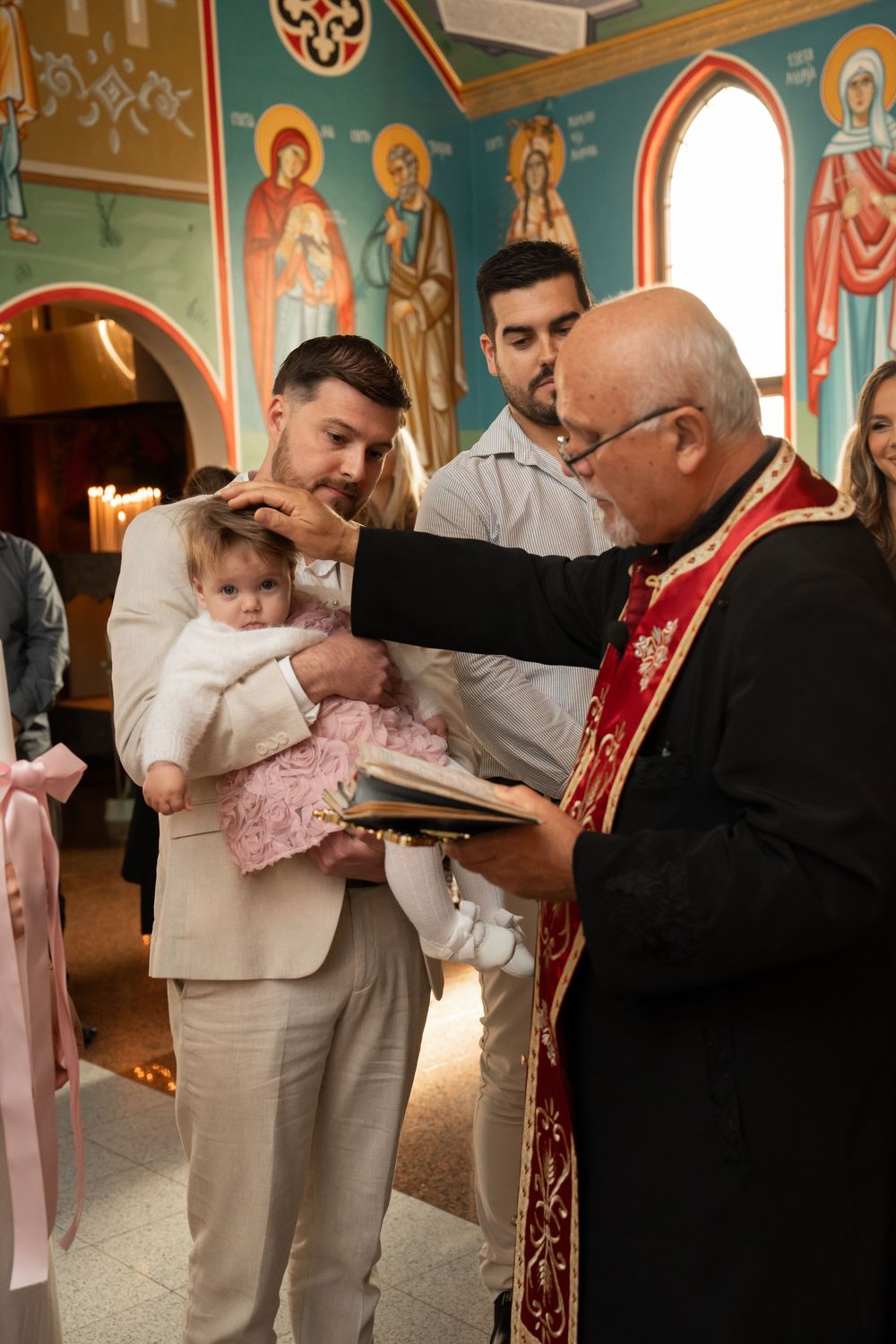 Natural Christening photography during a Macedonian Orthodox church ceremony