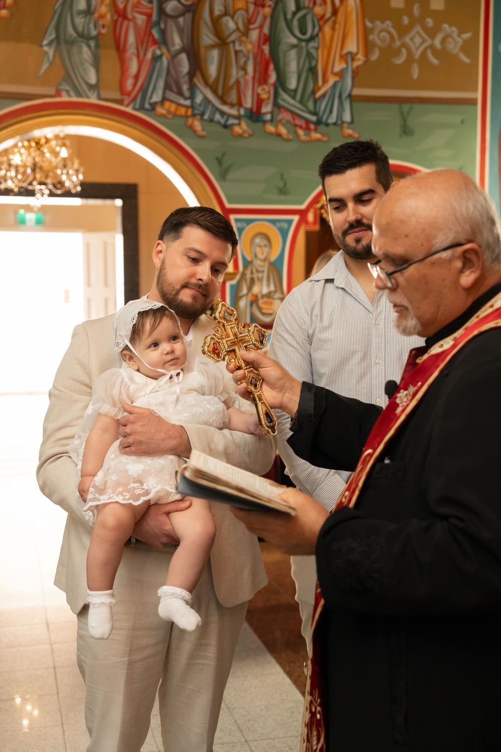 Orthodox Christening photographer documenting a traditional church baptism