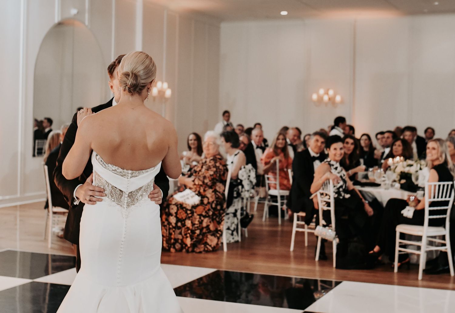Romantic first dance beneath candlelight at an elegant Dallas wedding