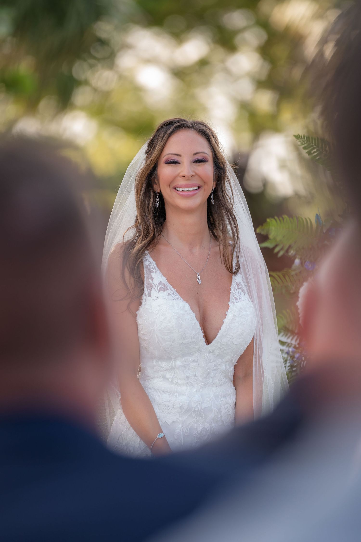 Bride smiling during her ceremony on the South Terrace at the Mansion at Tuckahoe