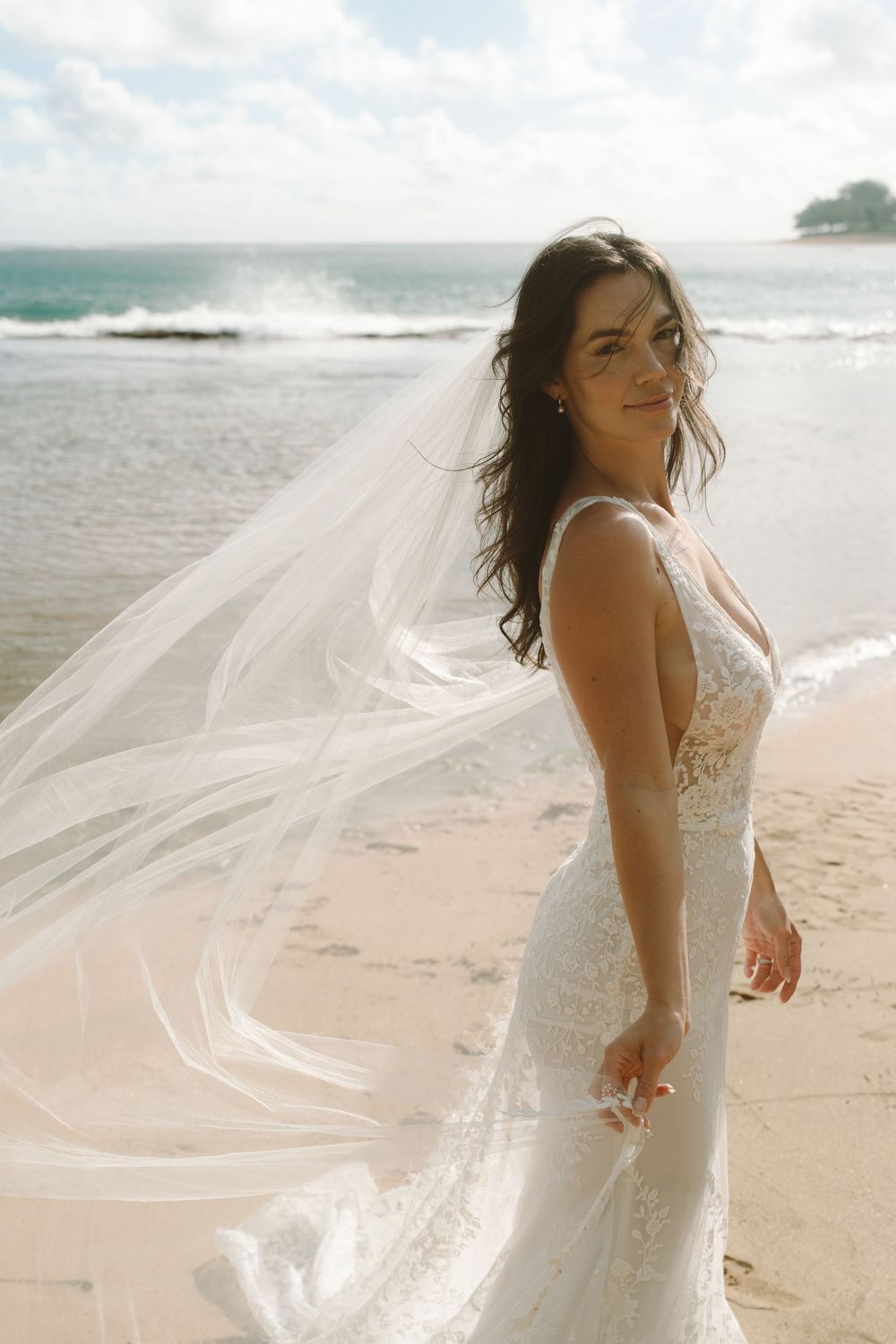 documentary style wedding portraits of bride at Tunnels Beach