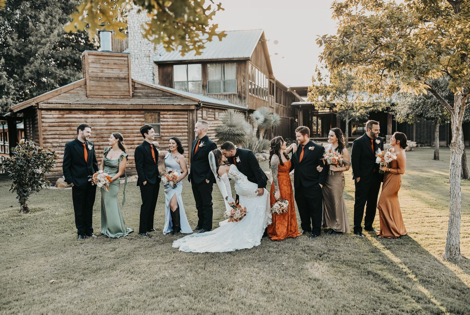 Bridal party posing in warm sunset light at Lucky Spur Ranch