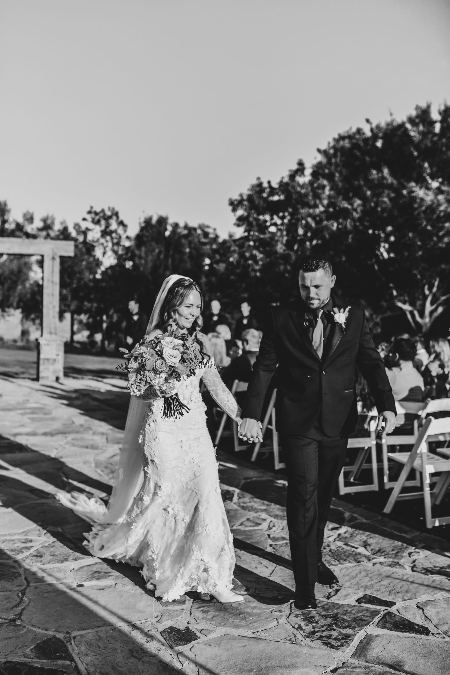 Bride and groom exchanging vows during an outdoor ranch ceremony