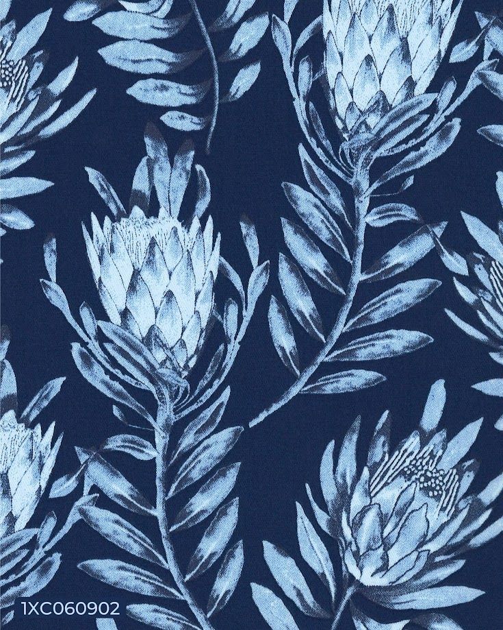 Navy blue fabric with light blue protea flowers and leaves in a botanical repeat pattern.