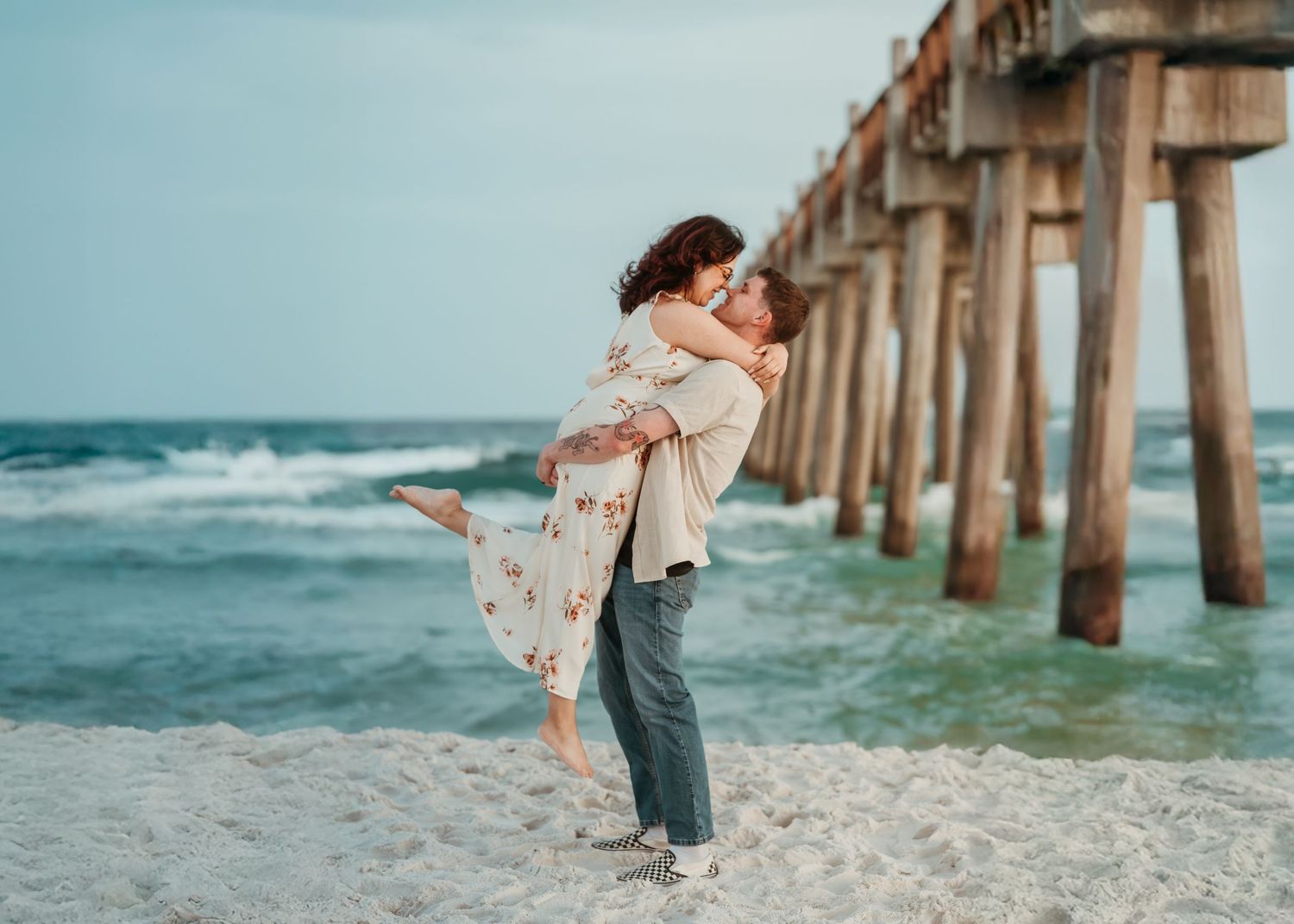 Couple embracing during a relaxed photography session on Pensacola Beach