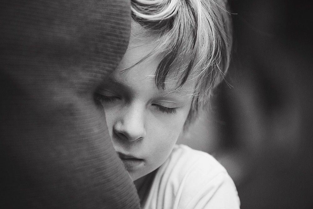 Emotional black and white child portrait photographed by fine art family photographer