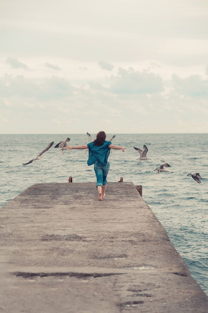 Destination female photography by the sea captured by Houston-based photographer