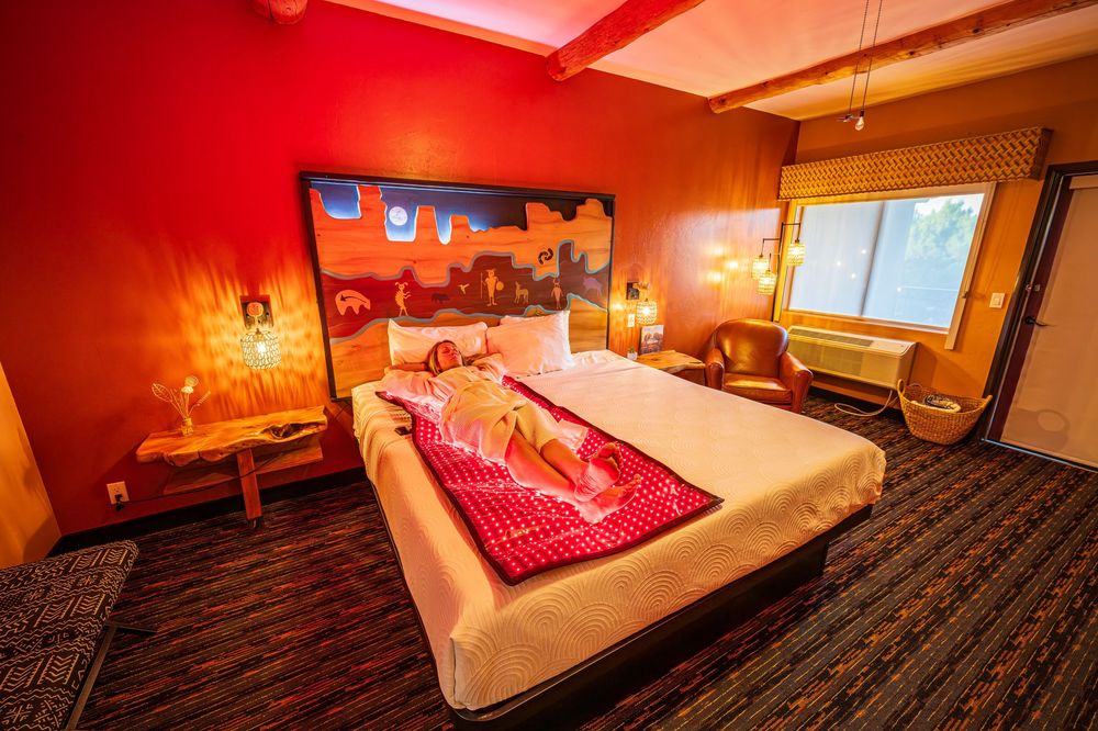 Woman enjoying red light therapy at a luxury hotel, The Southwest Inn in Sedona, AZ.