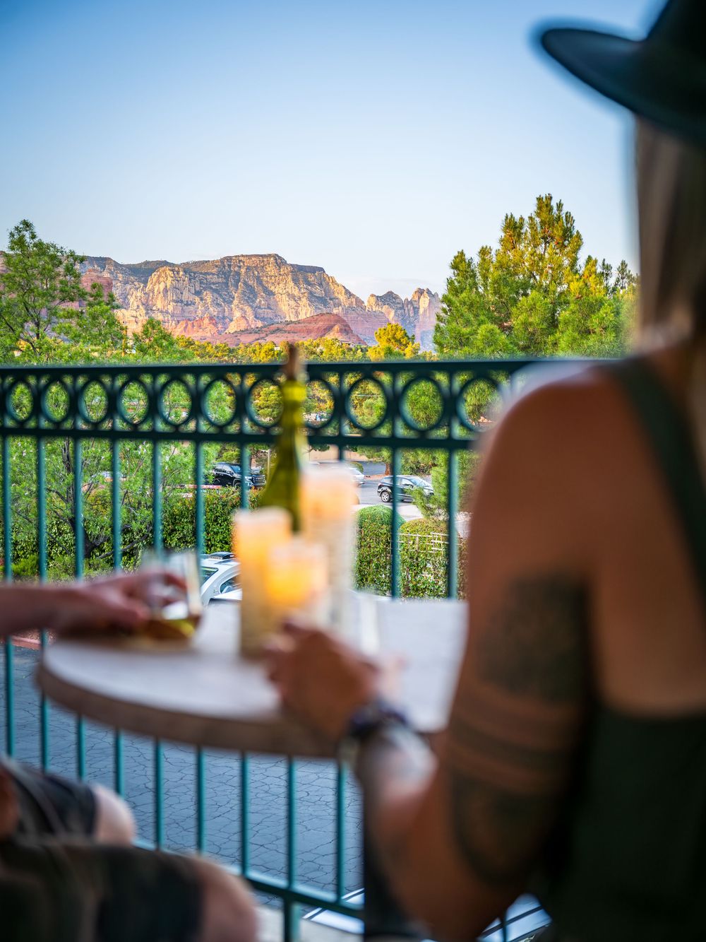A couple taking in the views at a luxury hotel, The Southwest Inn in Sedona, AZ.