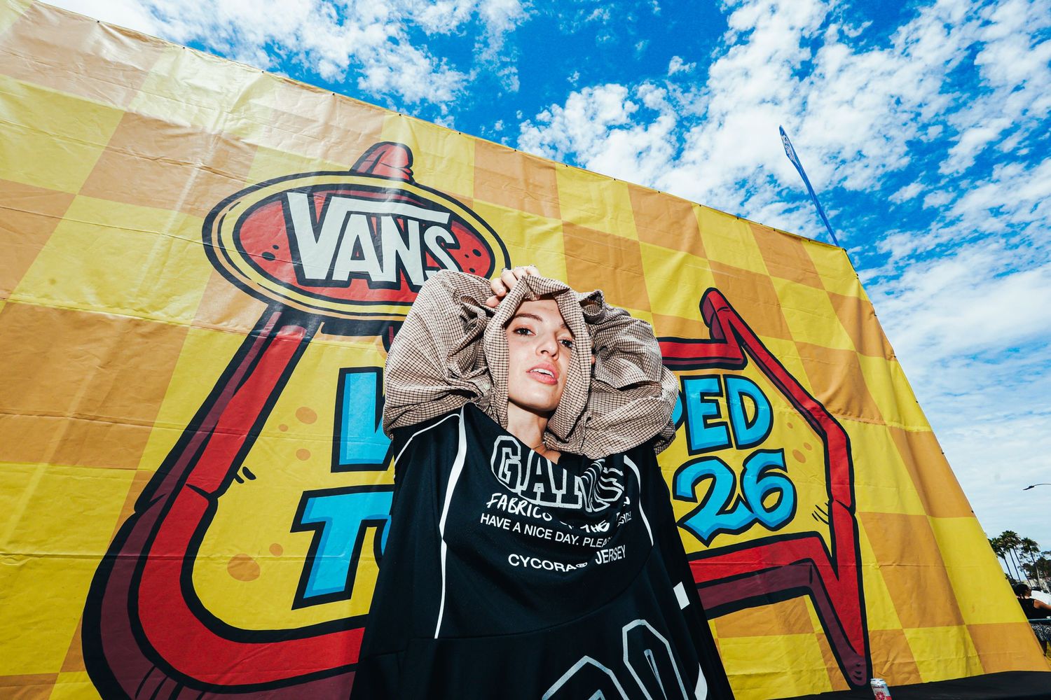 Addie Addie Addie at Vans Warped Tour 2026 in Long Beach, CA. Addie posing with a large Vans Warped Tour sign.