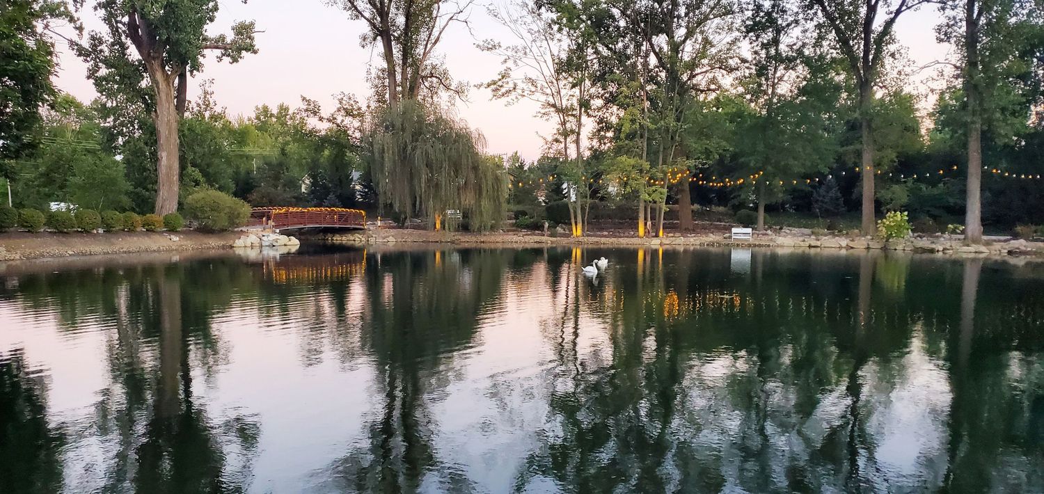 Serene park pond at Swan Lake Event Center Wedding Venue