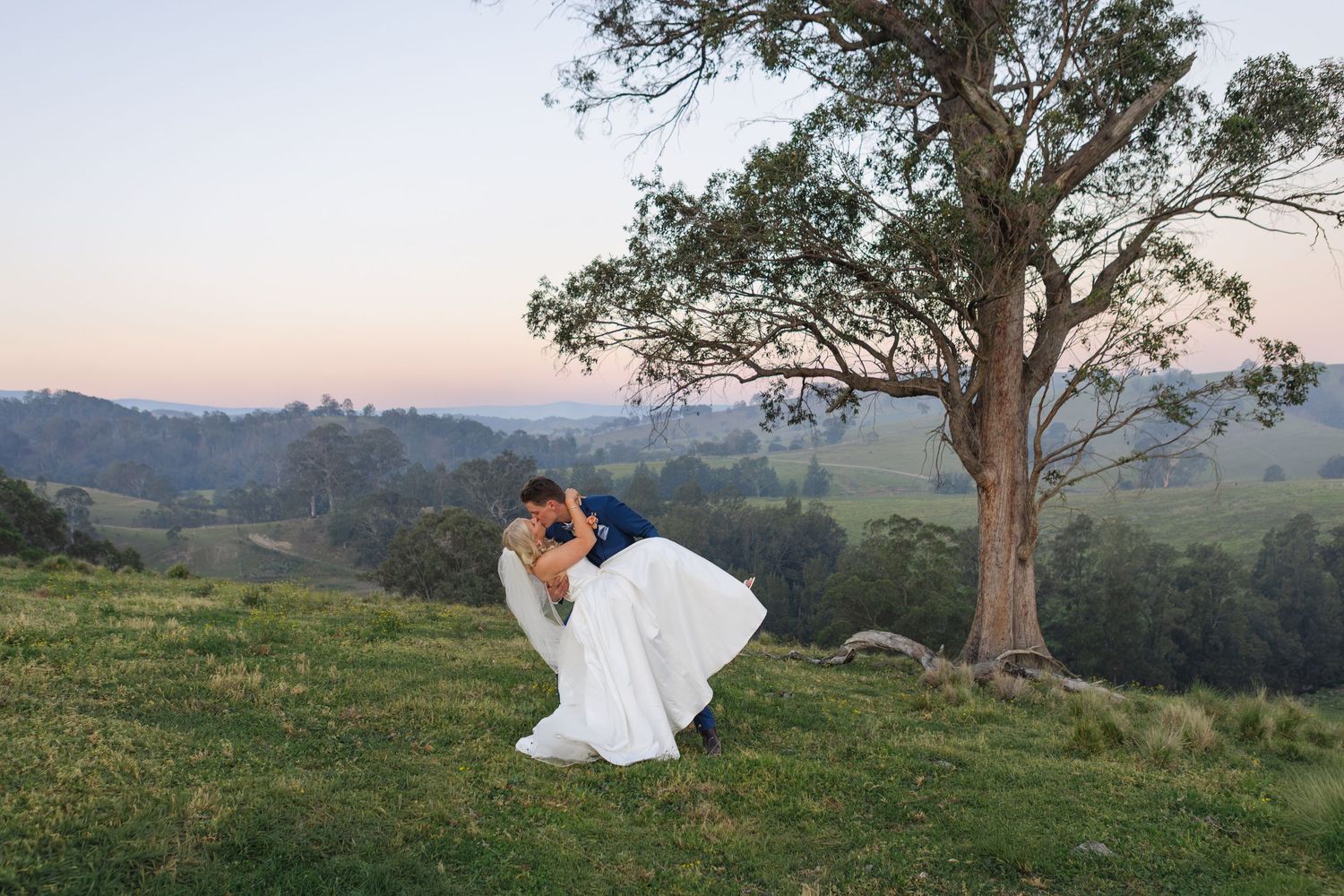 Jess and Lachie kissing during sunset wedding portraits at Dungog Weddings in the Hunter Valley NSW