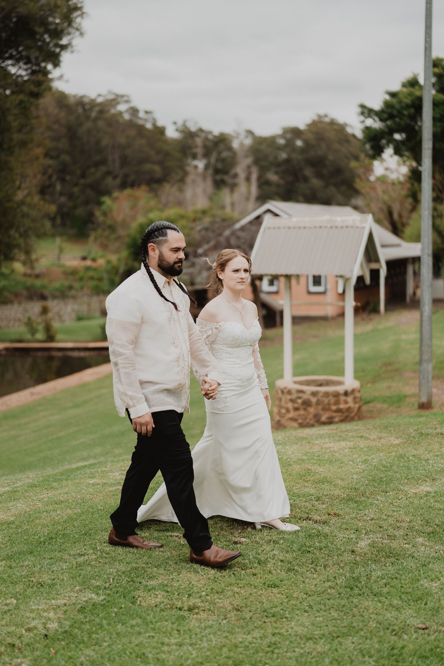 Christopher and Lucy walking across the lawn together