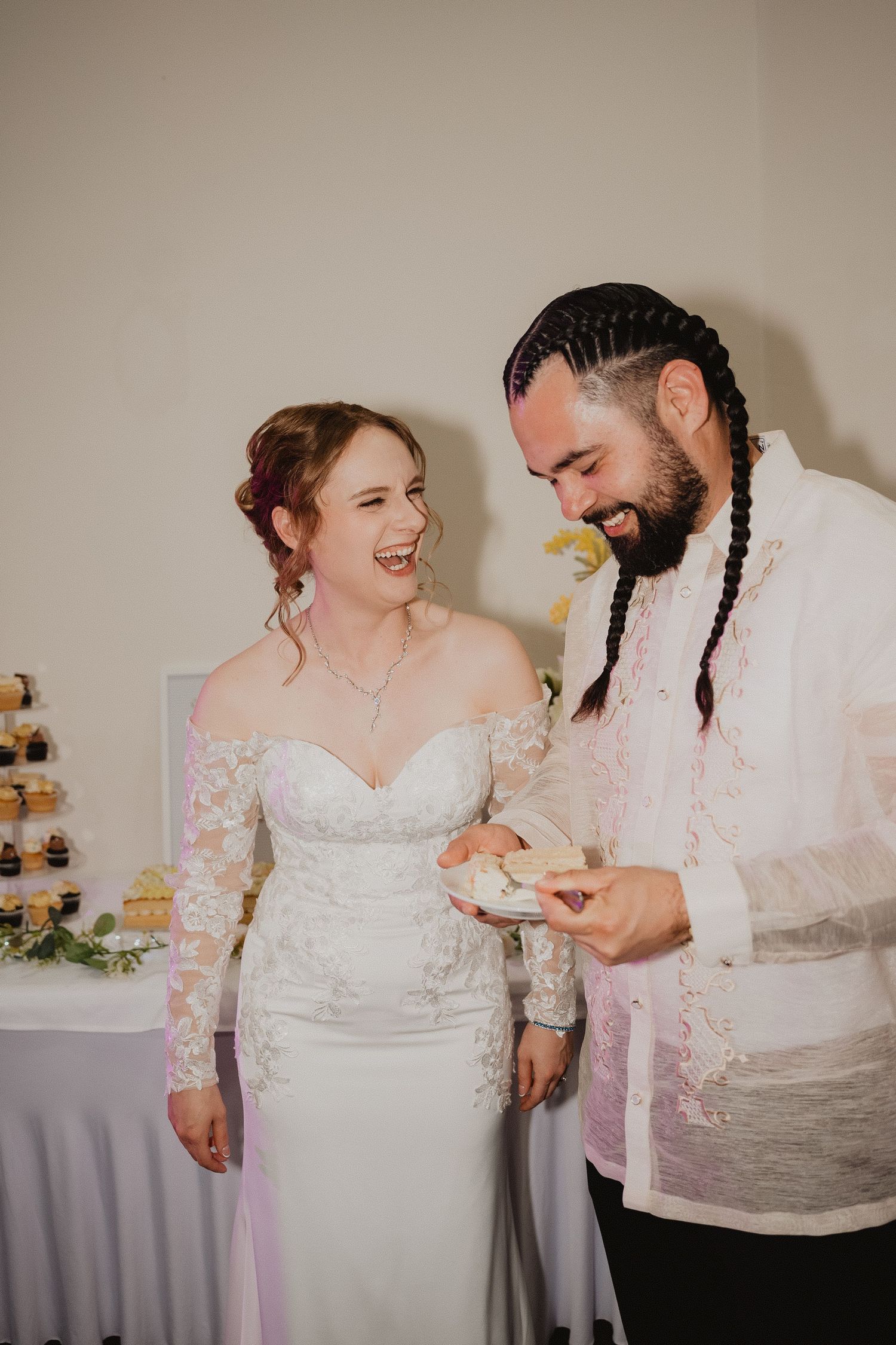 Christopher and Lucy cutting their wedding cake