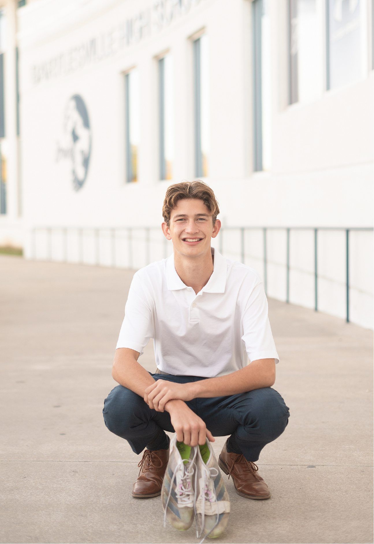 Bartlesville High Senior Guy Session in Downtown Bartlesville, BHS Track and Grassy Field by Bartlesville Senior Photogr