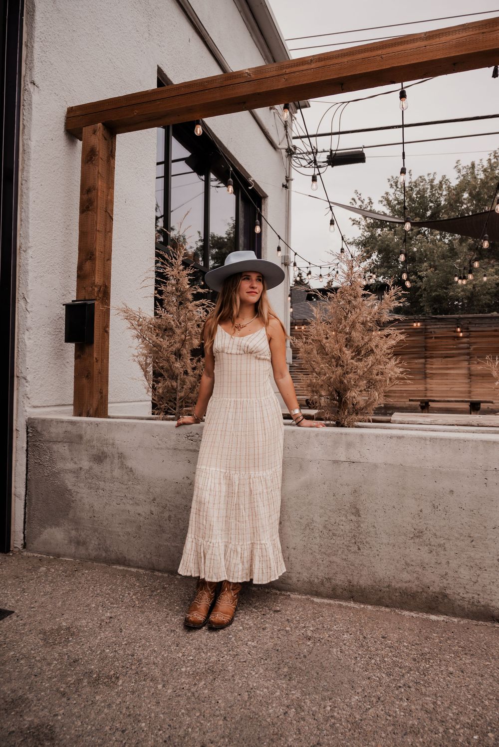 Summer fashion photo featuring a light and airy Free People dress, styled in a western theme.