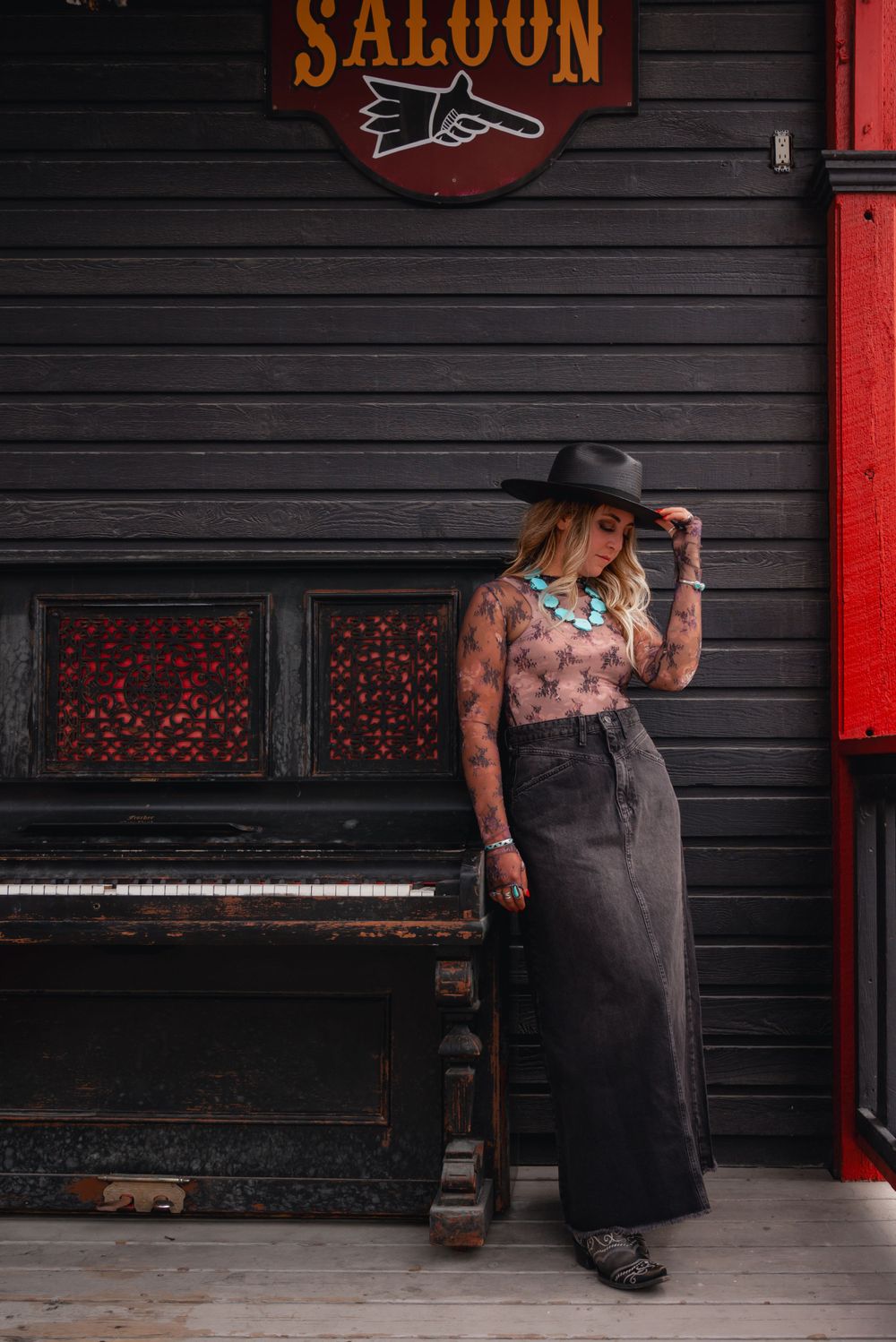 Western fashion shoot at Texas Gate Bar & Grill in Cochrane, featuring a lace top from Free People.