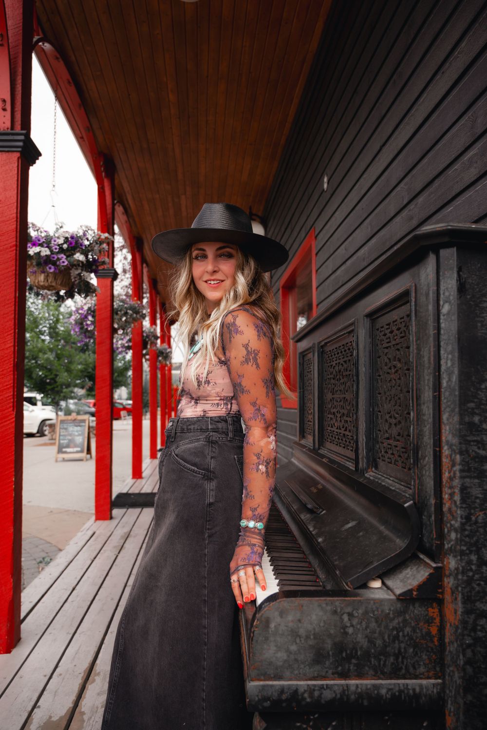 Western fashion shoot at Texas Gate Bar & Grill in Cochrane, featuring a lace top from Free People.