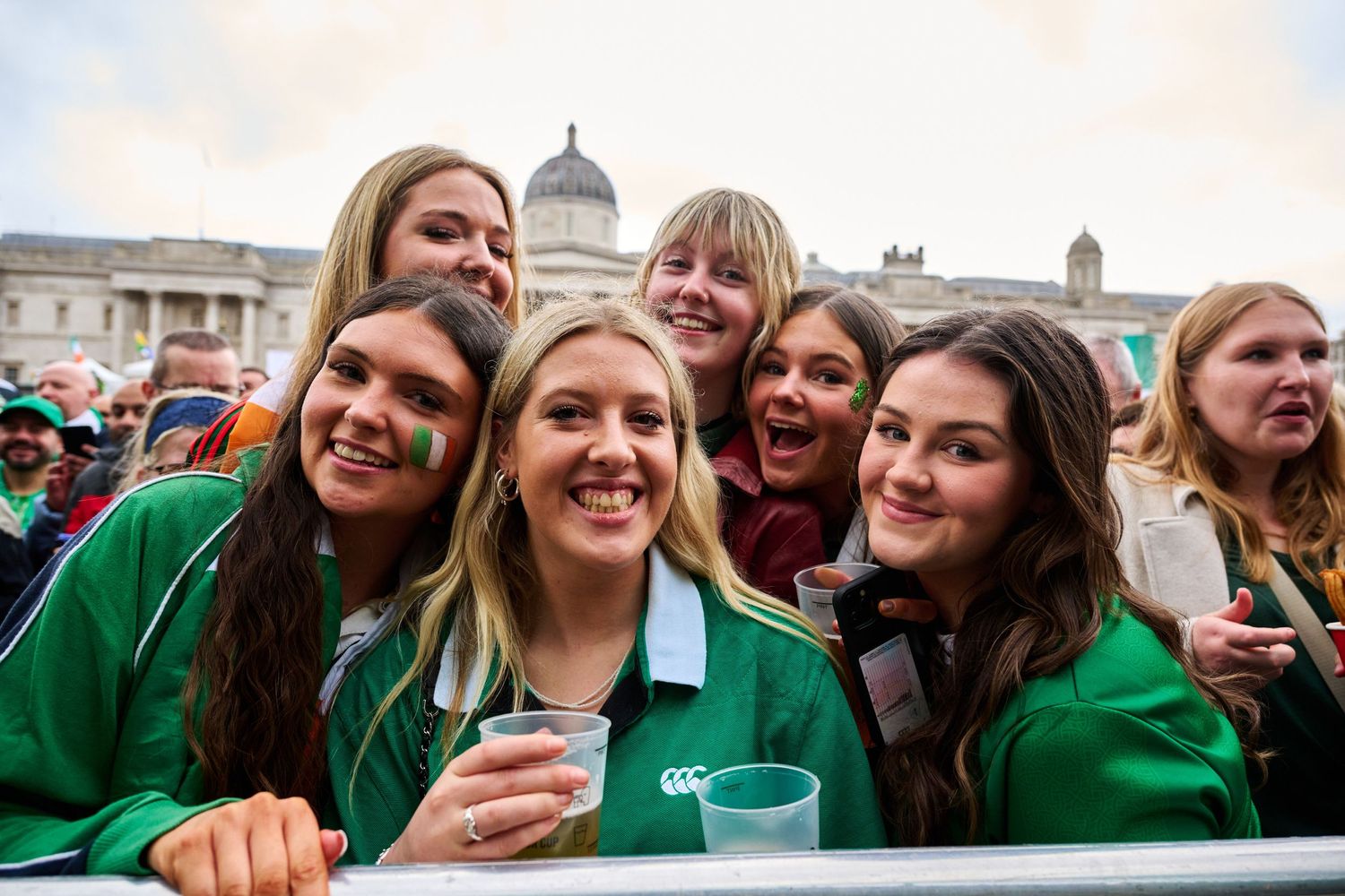 Seven girls pose for a photograph during the 2024 Saint Patricks Day parade in London. Photo by Bad Apple Event Photography.
