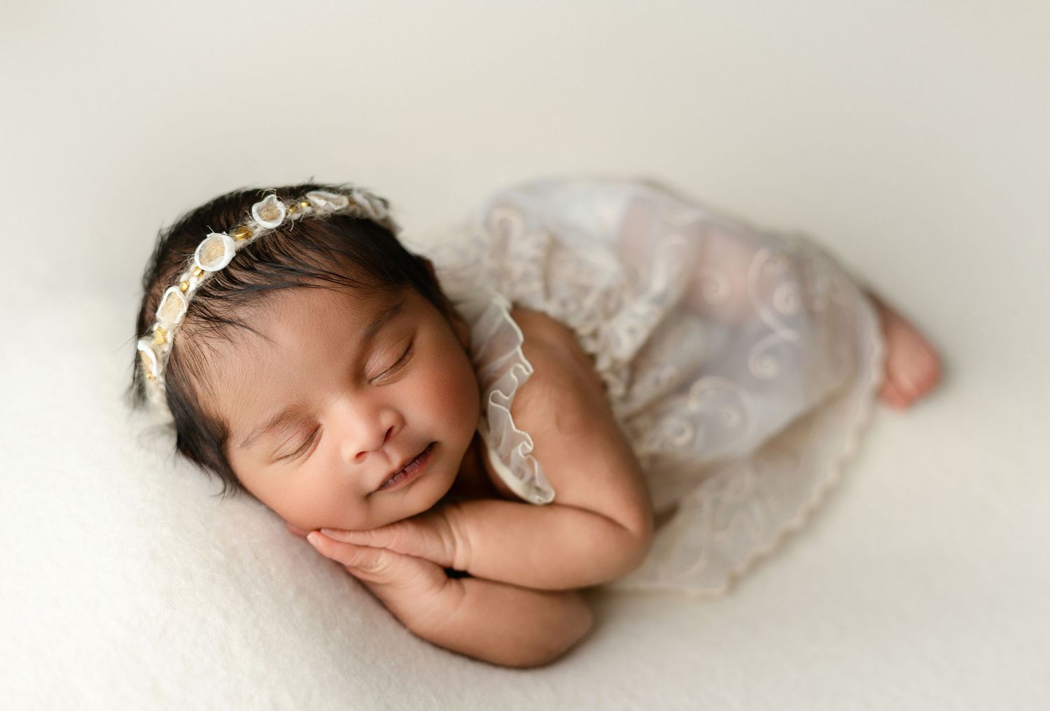 An Indian newborn in cream dress. Greenville SC newborn photographer, Easley, SC newborn photographer