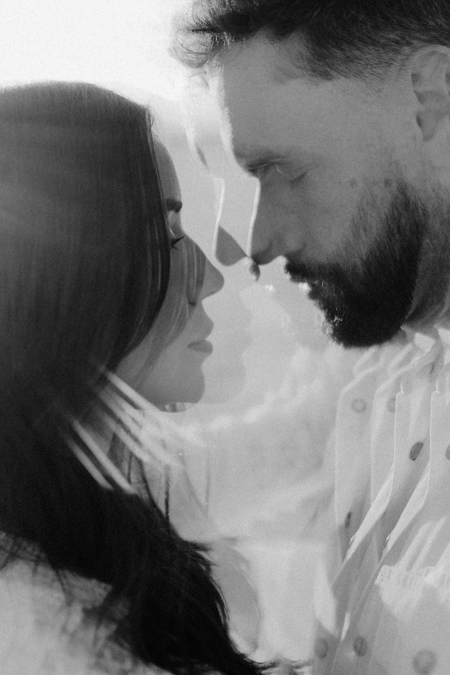 Artistic black and white portrait series showing intimate couple moments.