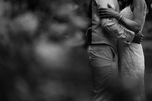 Black and white romantic wedding portraits showing intimate moments between couples during their special day.