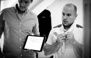 A sequence of black and white photos showing people collaborating in a professional office setting.