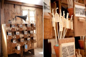 Vintage wooden shelving units with labels and storage compartments line the walls of an old workshop interior.