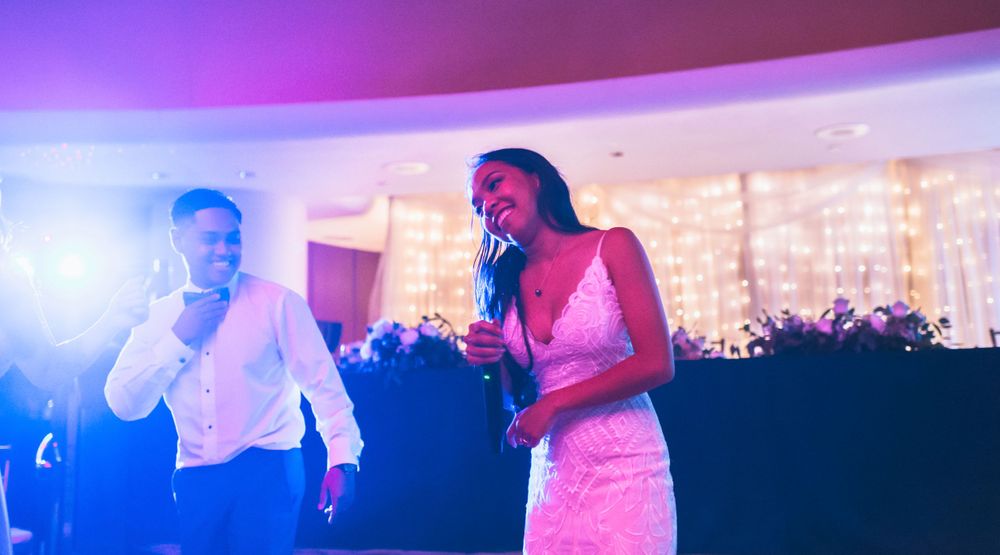 Dance party scene with purple and blue lighting effects creating a vibrant atmosphere.
