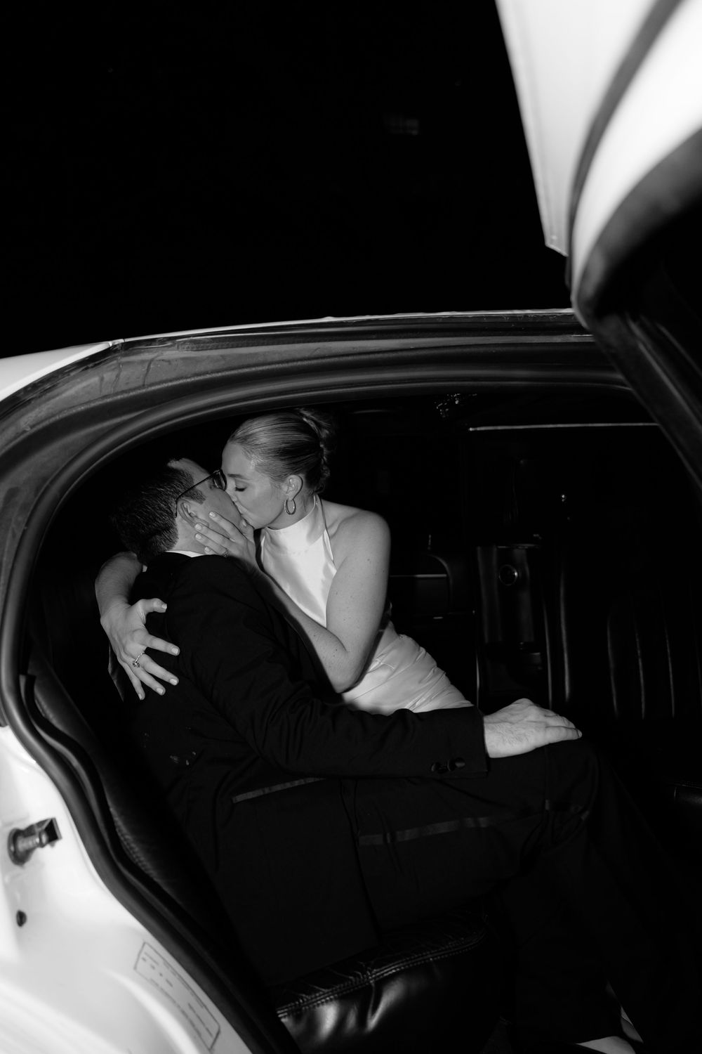 A black and white photo sequence showing someone getting into the back seat of a car at night.
