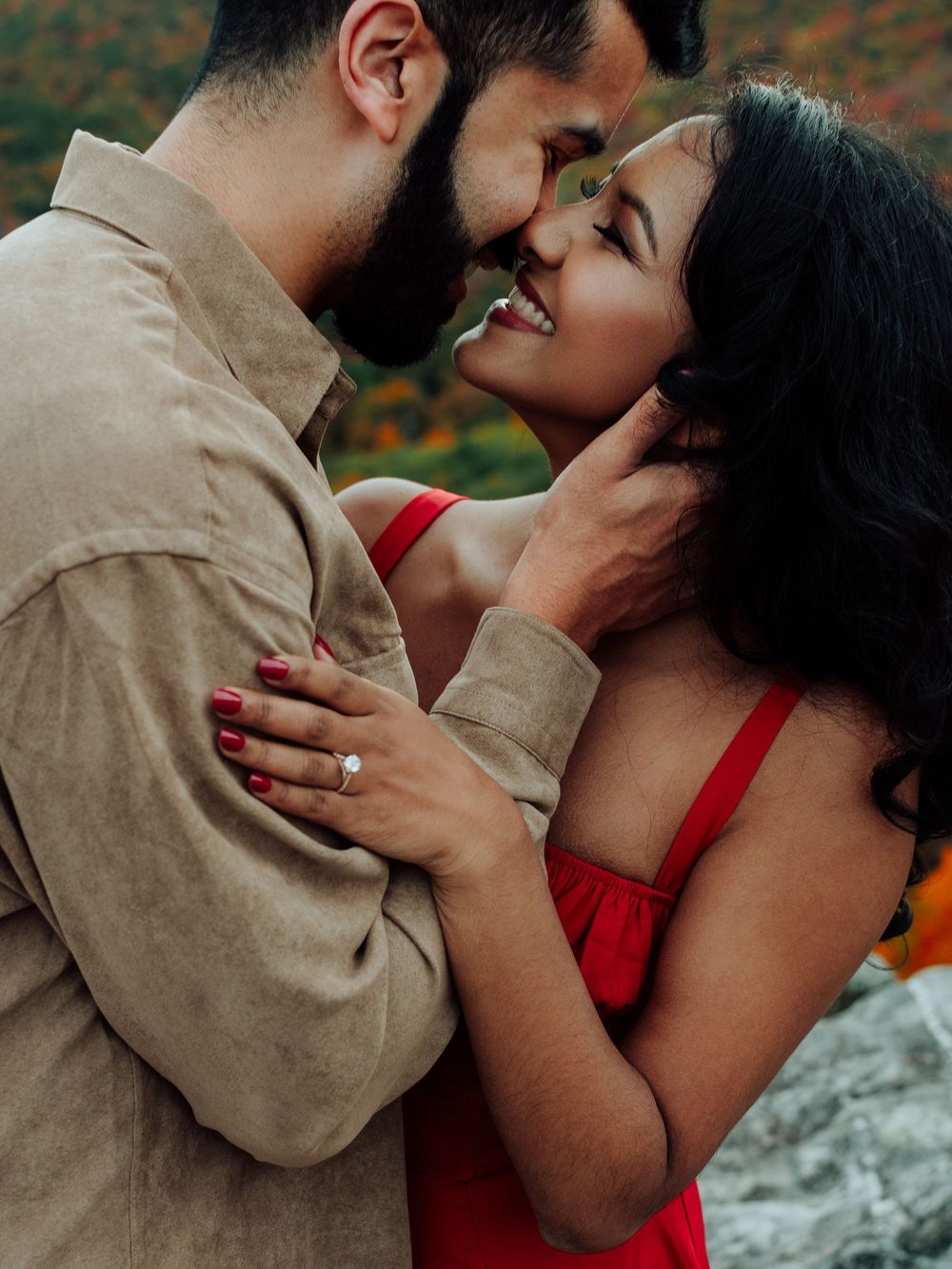 Romantic fall engagement photos of couple and puppy at Rough Ridge Overlook in Asheville, North Carolina.