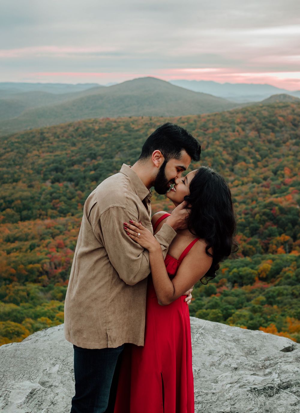 Romantic fall engagement photos of couple and puppy at Rough Ridge Overlook in Asheville, North Carolina.