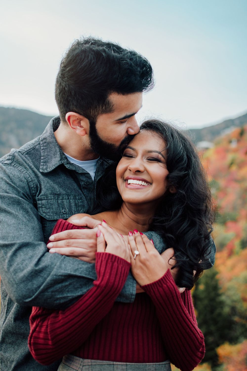 Romantic fall engagement photos of couple and puppy at Rough Ridge Overlook in Asheville, North Carolina.