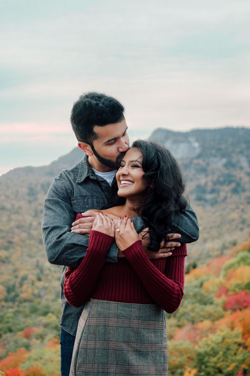Romantic fall engagement photos of couple and puppy at Rough Ridge Overlook in Asheville, North Carolina.