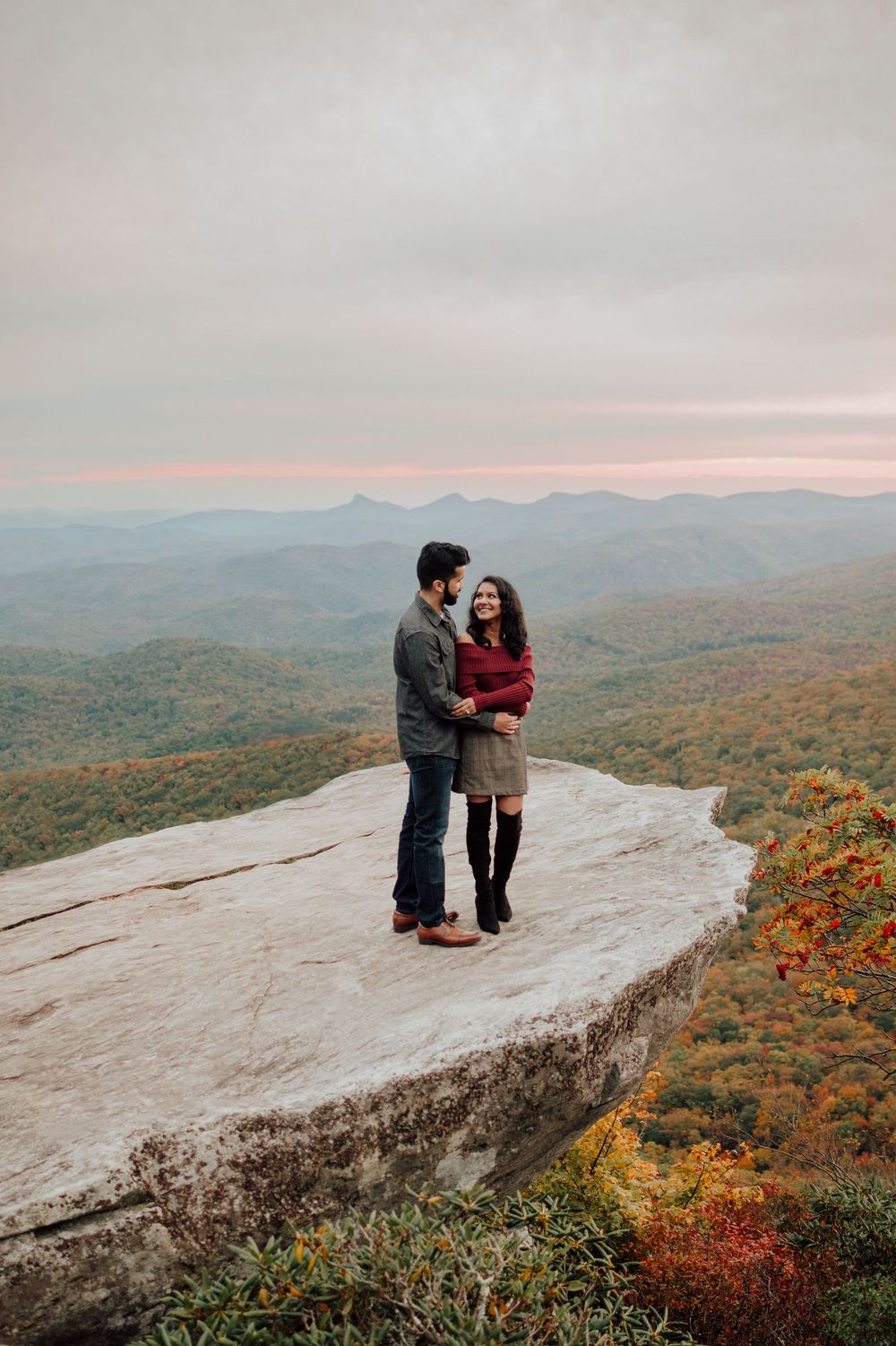 Romantic fall engagement photos of couple and puppy at Rough Ridge Overlook in Asheville, North Carolina.