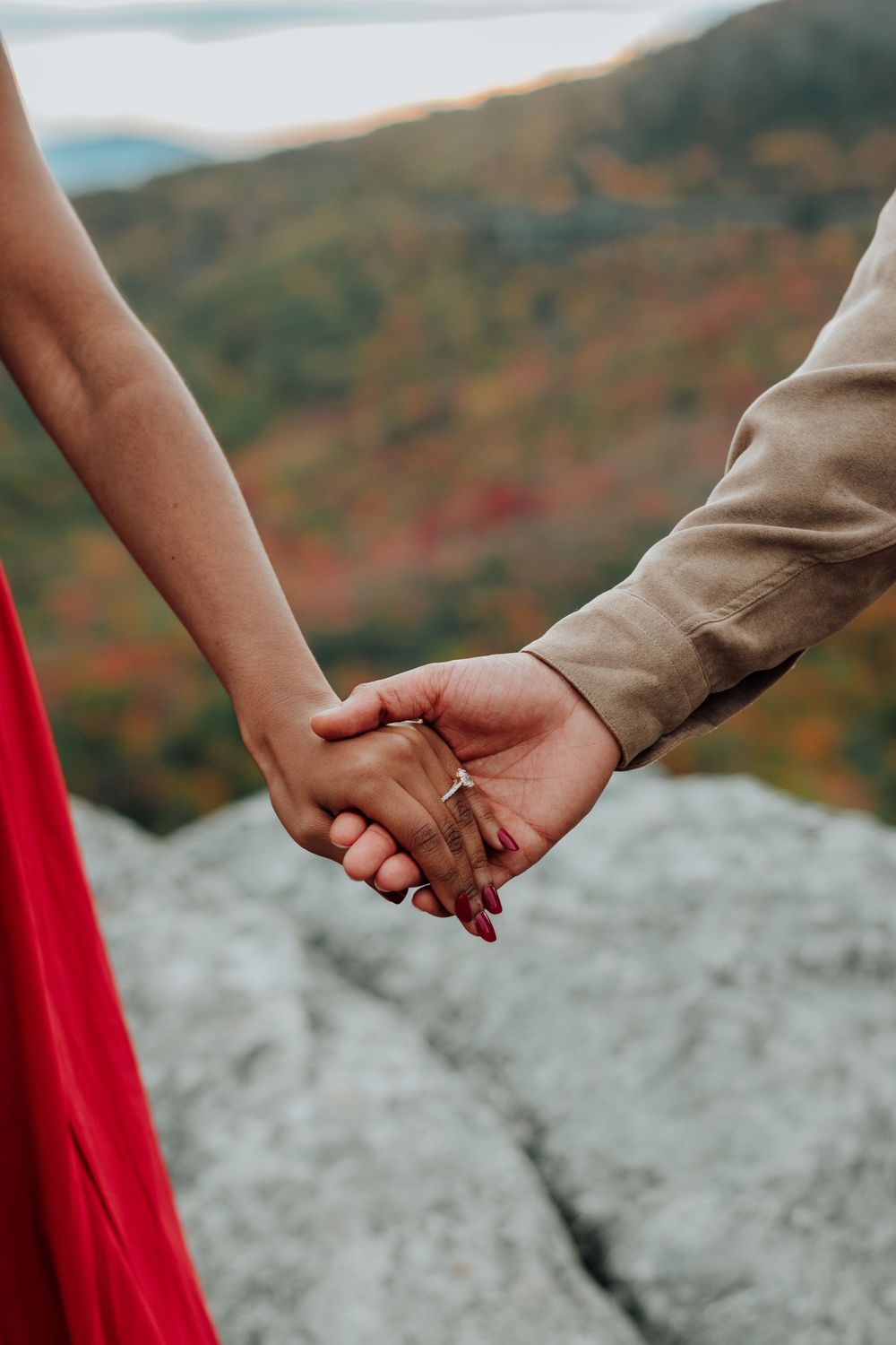 Romantic fall engagement photos of couple and puppy at Rough Ridge Overlook in Asheville, North Carolina.
