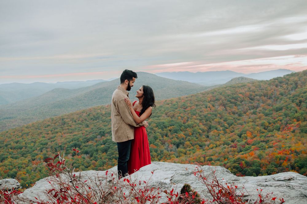 Romantic fall engagement photos of couple and puppy at Rough Ridge Overlook in Asheville, North Carolina.