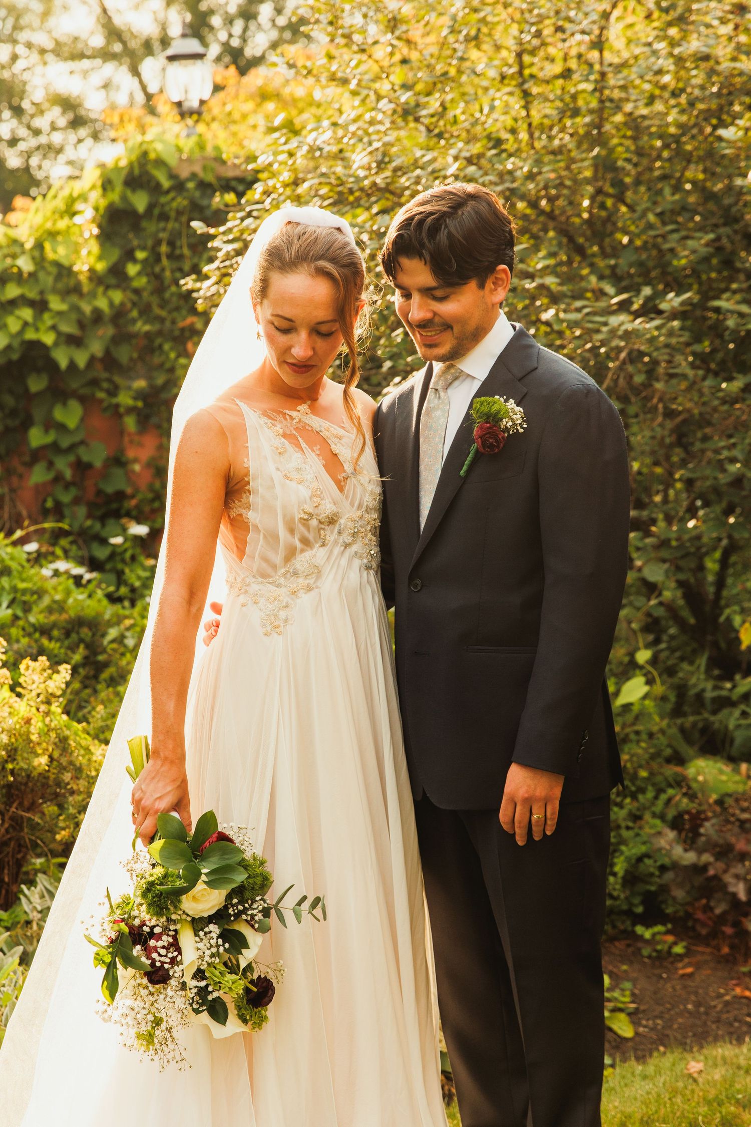 A collection of intimate wedding portraits showing a couple in a sunlit garden with autumn foliage.