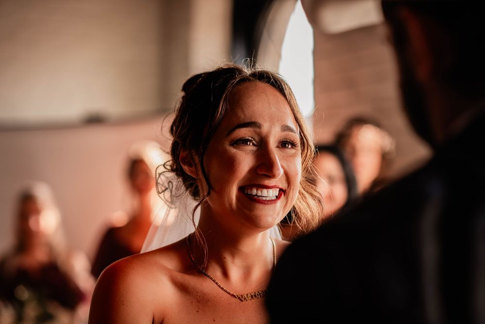 Bride saying her vows during a wedding ceremony at the Pie Eyed Monk Brewery in Lindsay, Ontario.