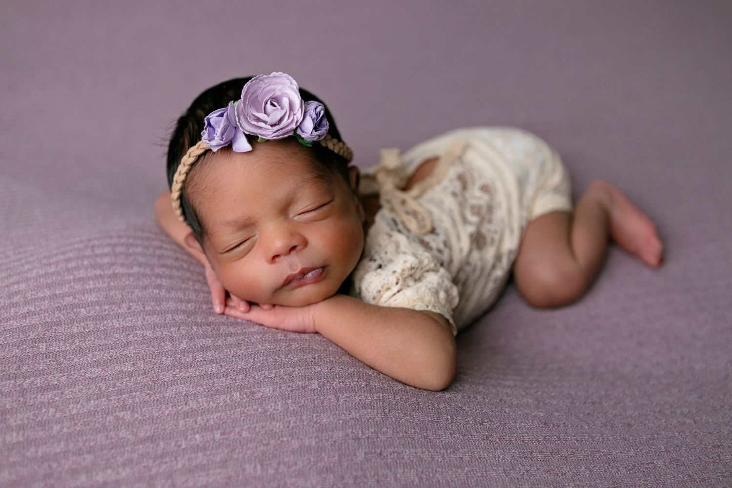 A sleeping newborn baby with purple headband, Orlando Newborn Photography, Sanford Newborn Photography, How to put your newborn to sleep