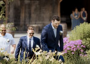 Groom and groomsmen walk down the aisle during weekday ceremony at Blueberry Hill Farms wedding photography packages with value